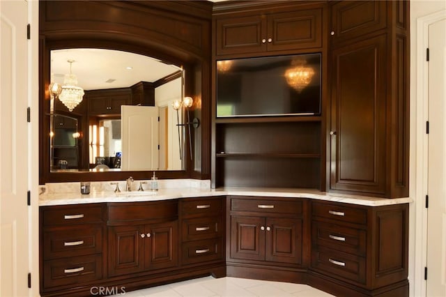 bathroom featuring tile patterned flooring and vanity