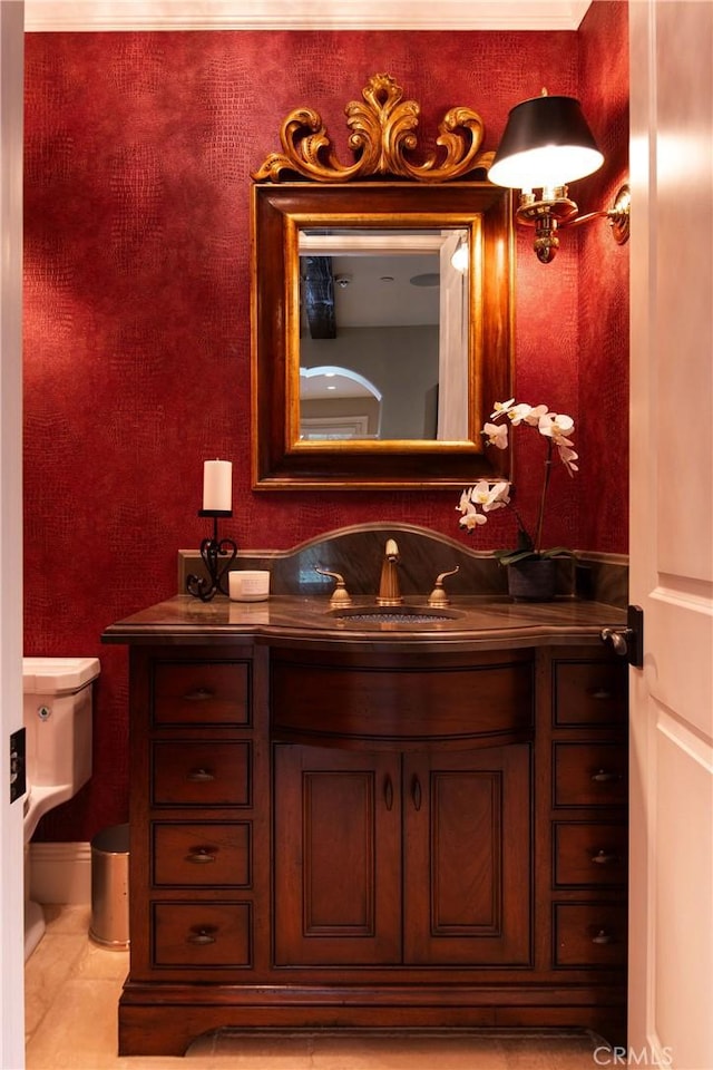 bathroom featuring tile patterned floors, vanity, and toilet