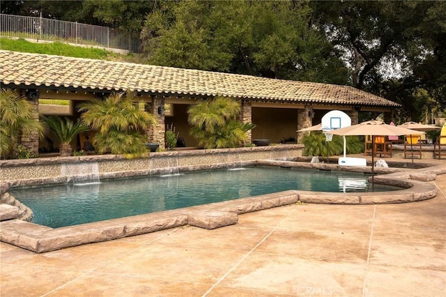 view of pool featuring a patio area and pool water feature