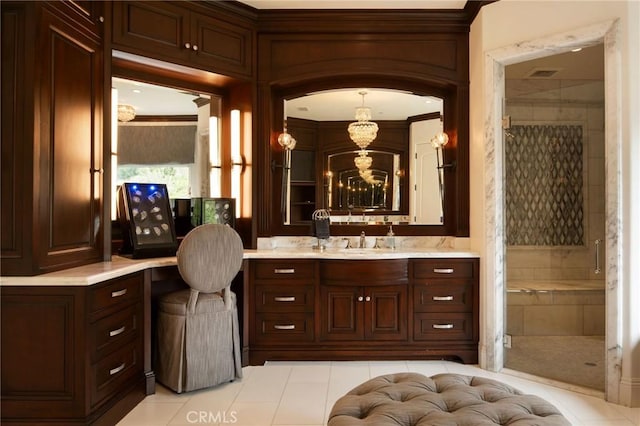 bathroom with tile patterned floors, crown molding, a shower with door, and vanity