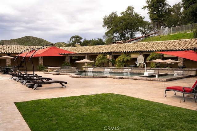 surrounding community featuring a lawn, a patio area, and a swimming pool