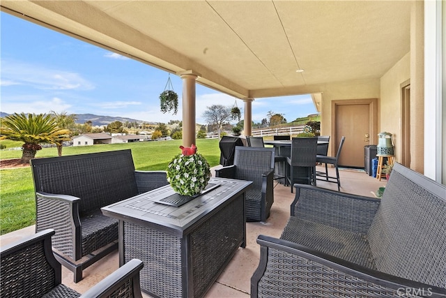 view of patio / terrace featuring a mountain view