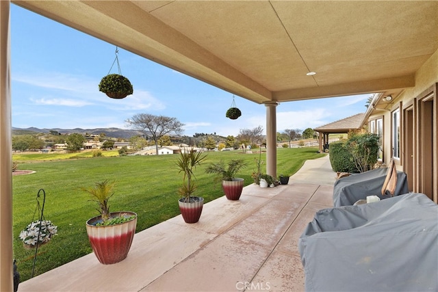 view of patio / terrace with a mountain view