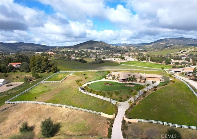 birds eye view of property with a rural view and a mountain view