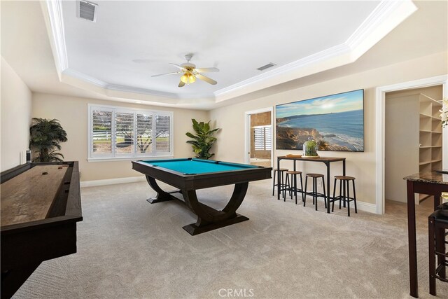 recreation room with pool table, a raised ceiling, light carpet, and ceiling fan