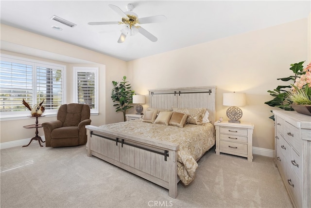 carpeted bedroom with ceiling fan