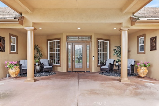 property entrance featuring a patio