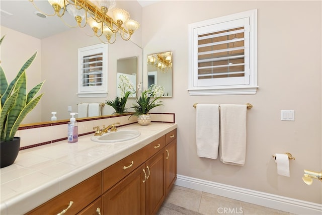 bathroom with tile patterned floors and vanity