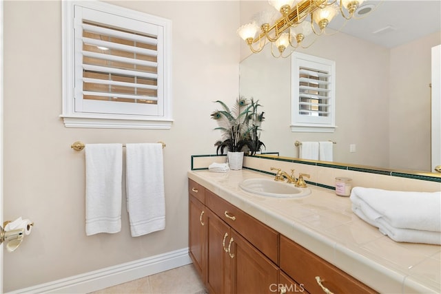 bathroom with tile patterned flooring and vanity