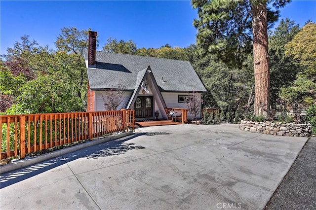 exterior space featuring a wooden deck