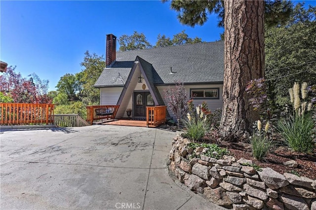 exterior space featuring a wooden deck