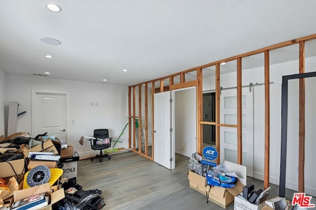 miscellaneous room featuring hardwood / wood-style floors