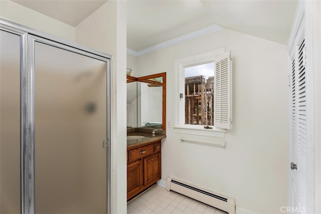 bathroom featuring a baseboard heating unit, vanity, ornamental molding, and a shower with shower door