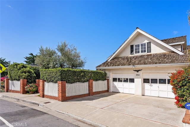 view of side of property featuring a garage