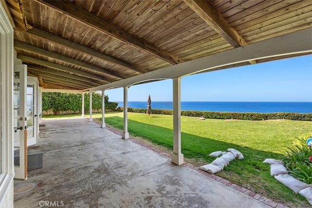 view of patio featuring a water view