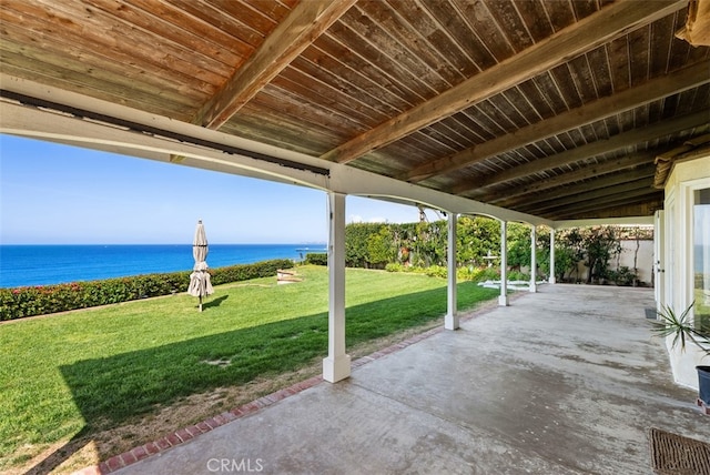 view of patio with a water view