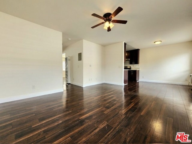 unfurnished living room with dark wood-type flooring and ceiling fan