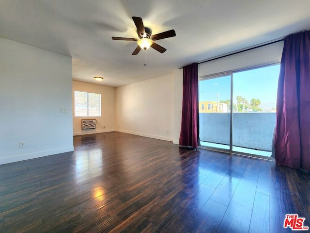 spare room with ceiling fan and dark hardwood / wood-style floors