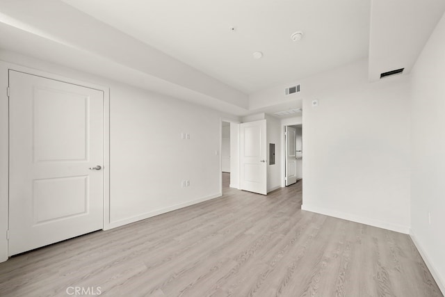 spare room with light hardwood / wood-style flooring