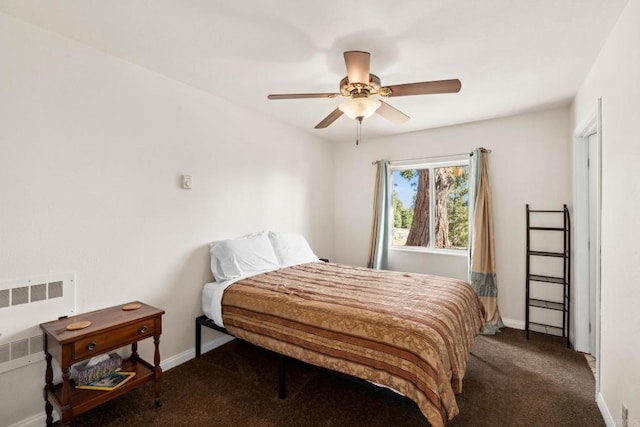 bedroom featuring ceiling fan, radiator, and dark colored carpet