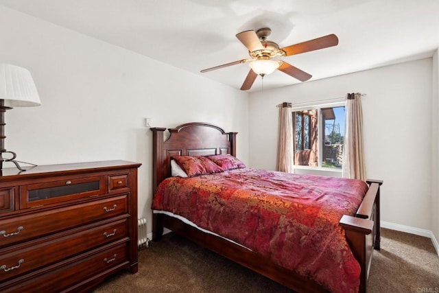 bedroom featuring ceiling fan and dark colored carpet