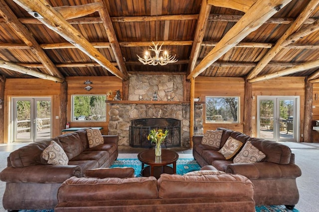 carpeted living room with a chandelier, wood walls, and wooden ceiling