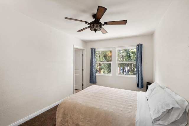 bedroom with ceiling fan and carpet flooring