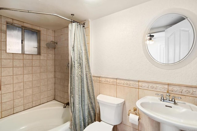 full bathroom featuring tile walls, backsplash, shower / tub combo, sink, and toilet