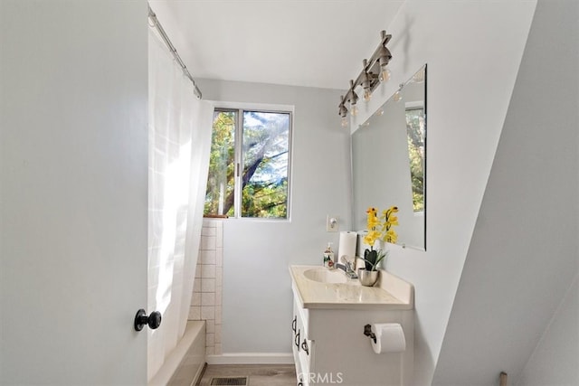 bathroom featuring shower / bath combo, vanity, and wood-type flooring