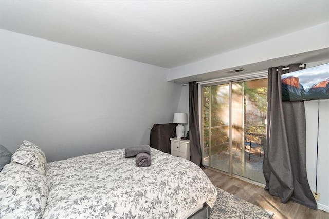 bedroom featuring hardwood / wood-style floors