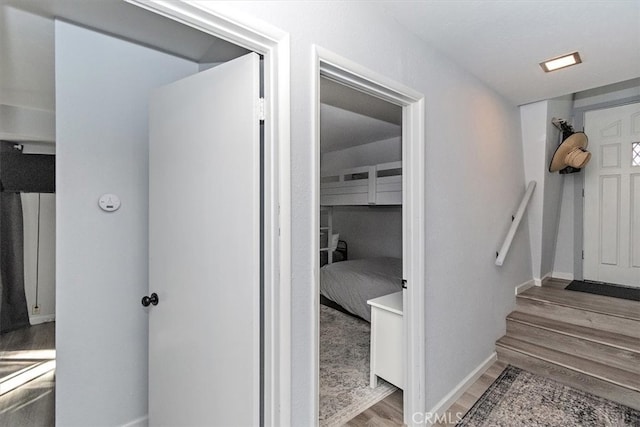 hallway with light hardwood / wood-style flooring