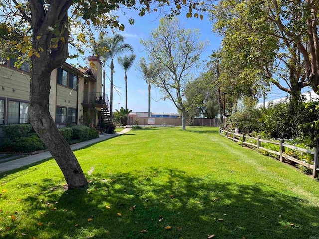 view of property's community with a lawn