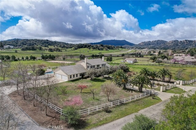 birds eye view of property featuring a mountain view and a rural view