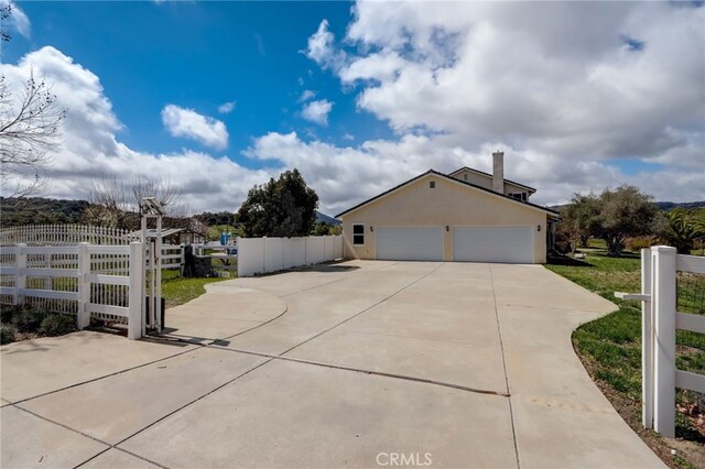 view of property exterior with a garage