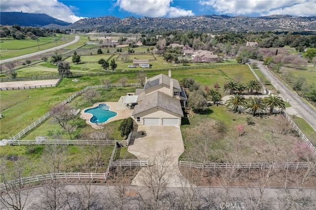 bird's eye view featuring a mountain view and a rural view