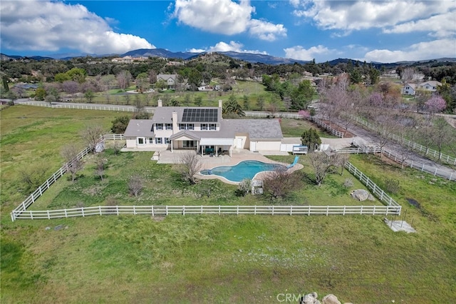 birds eye view of property with a mountain view and a rural view