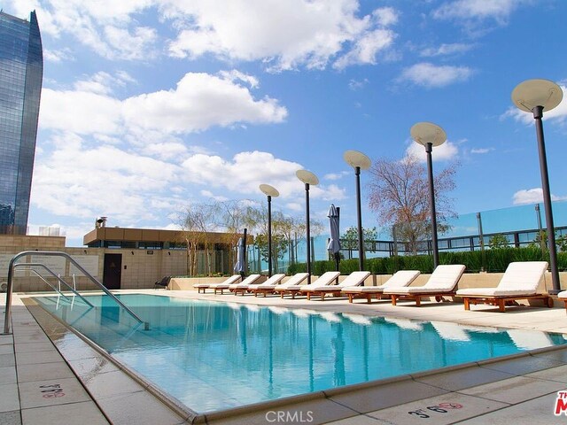 view of pool featuring a patio