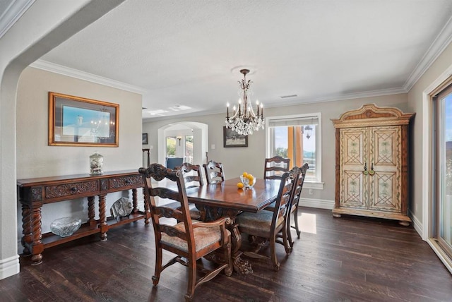 dining room with plenty of natural light, dark wood-type flooring, and crown molding