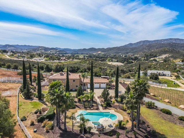 birds eye view of property featuring a mountain view