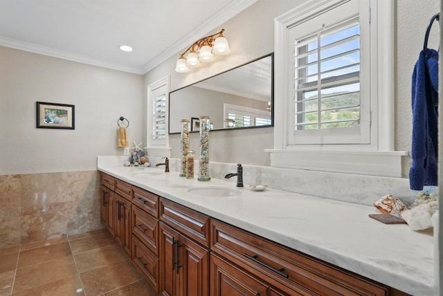 bathroom featuring ornamental molding, tile patterned floors, and vanity