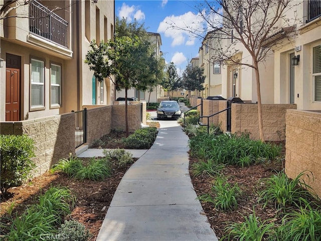 view of community with a fenced front yard