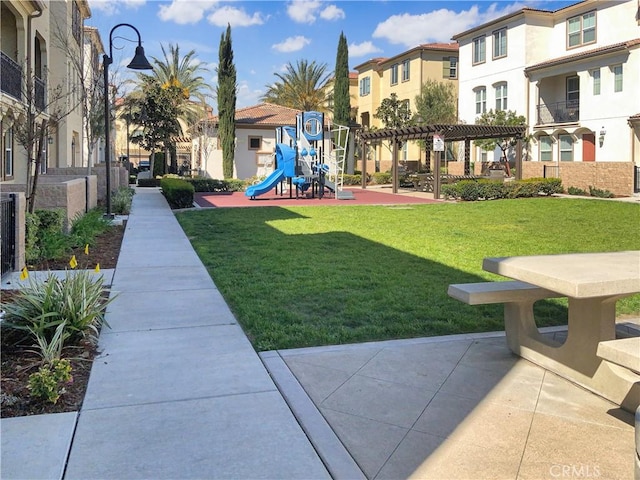 view of home's community featuring a residential view, playground community, a lawn, and a pergola