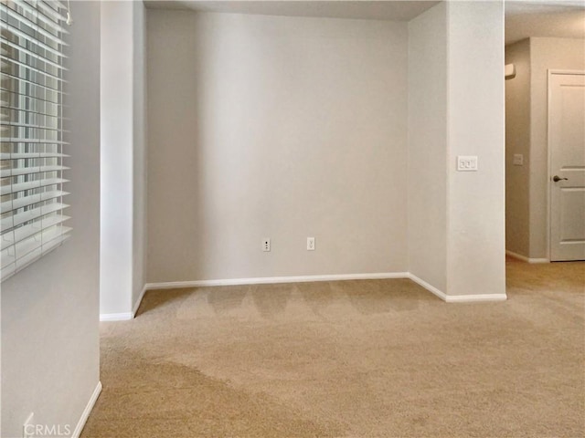 spare room with carpet floors and baseboards