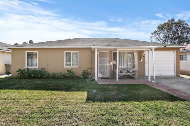 single story home with a garage and a front lawn