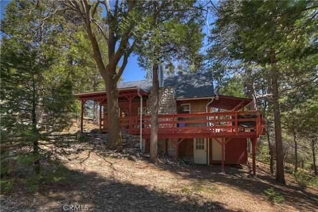 back of property featuring a deck