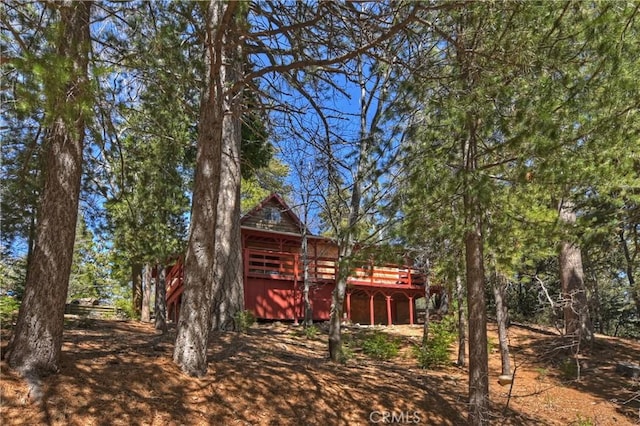 back of property with a wooden deck