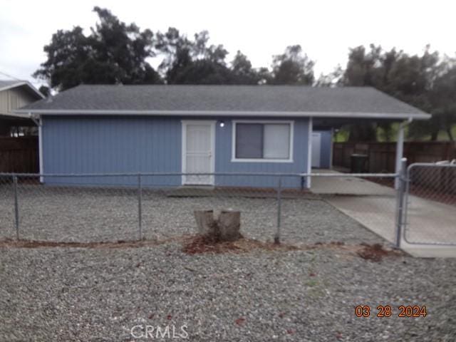 view of front of property featuring a carport