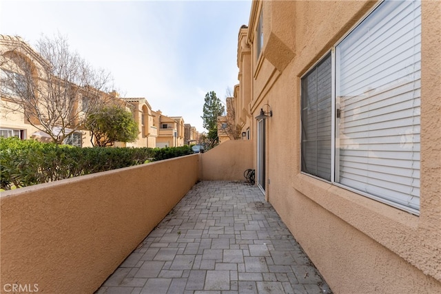 view of side of property featuring a balcony