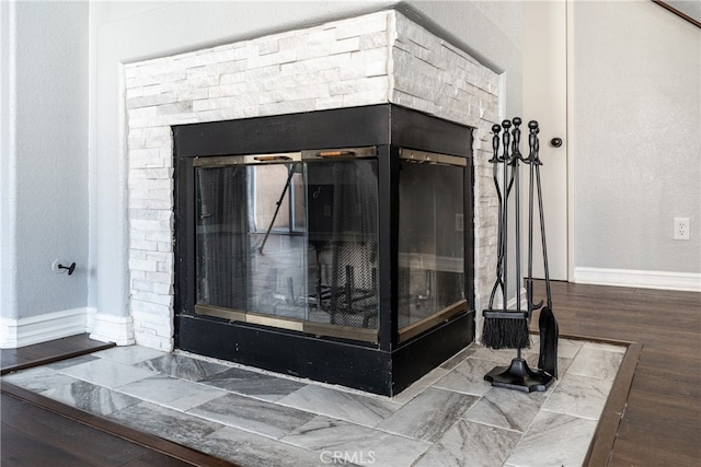 room details featuring hardwood / wood-style floors and a fireplace