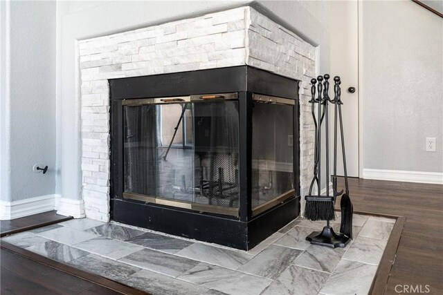 18840 Vista Del Canon Unit A, Newhall, CA 91321 - detailed view of baseboards, a fireplace, and wood finished floors